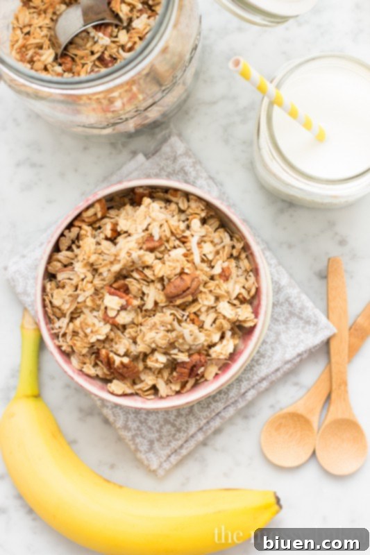 Ingredients for banana maple granola being mixed in a saucepan