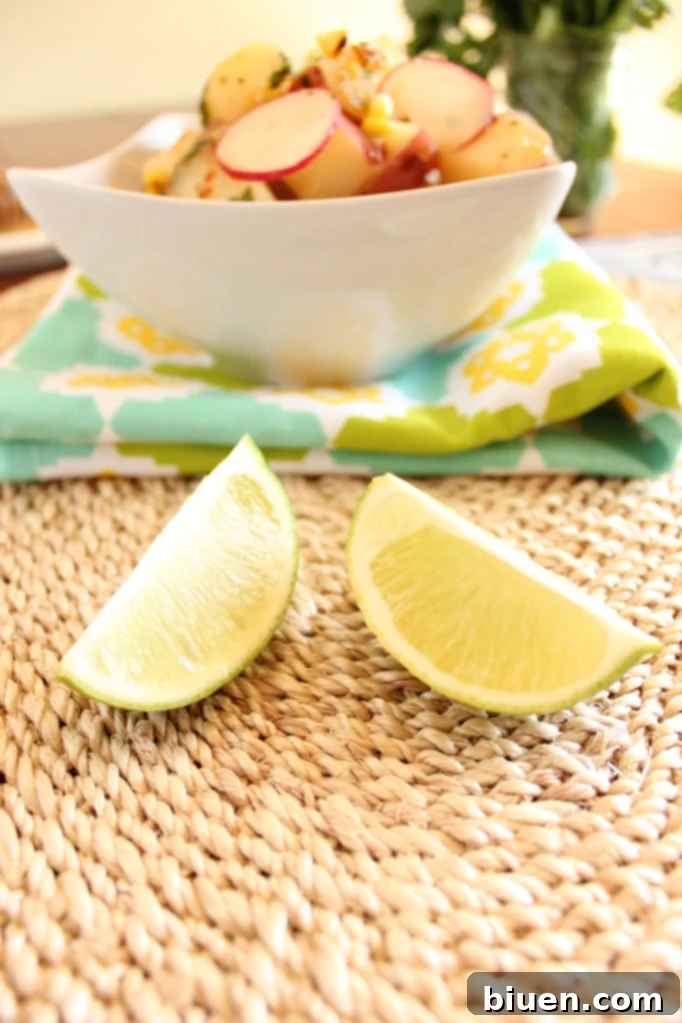 A close-up of vibrant ingredients like fresh red potatoes, crisp radishes, bright scallions, and fragrant cilantro laid out, ready for the salad
