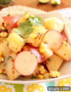 A bowl of fresh Red Potato and Grilled Corn Salad with Chipotle Lime Vinaigrette
