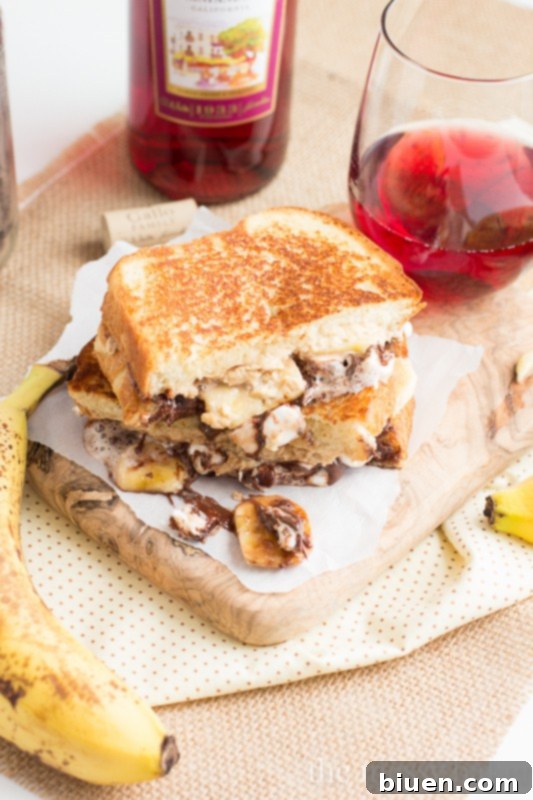 Funky Monkey Grilled Cheese Sandwich 6 Funky Monkey Dessert Grilled Cheese | Cross-section showing layers of chocolate, peanut butter, banana, and marshmallow