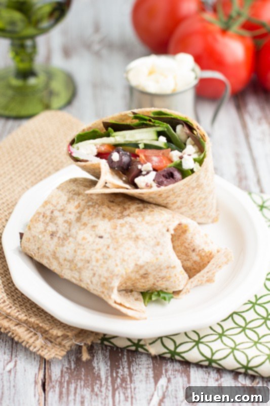 Vibrant Greek Wrap 5 Freshly made Greek Salad Wrap, ready to be eaten, showcasing its vibrant filling