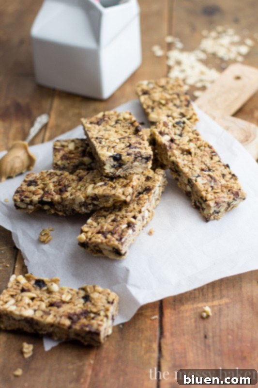 Gluten Free Chocolate Chip Peanut Butter Granola Bars 2 Delicious and healthy chocolate chip peanut butter granola bars, perfect for a gluten-free snack option. Features a close-up of the bars on a wooden surface.