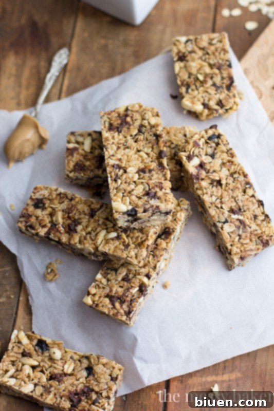 Gluten Free Chocolate Chip Peanut Butter Granola Bars 4 Close-up of the texture of homemade chocolate chip peanut butter granola bars, showing oats, seeds, and chocolate chips.