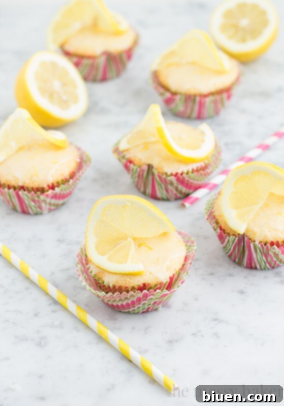 Sunshine Lemon Cupcakes with Zesty Glaze 2 Lemon Cupcakes with Lemon Glaze | www.themessybakerblog.com