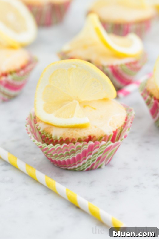 Sunshine Lemon Cupcakes with Zesty Glaze 4 Lemon Cupcakes with Lemon Glaze | www.themessybakerblog.com