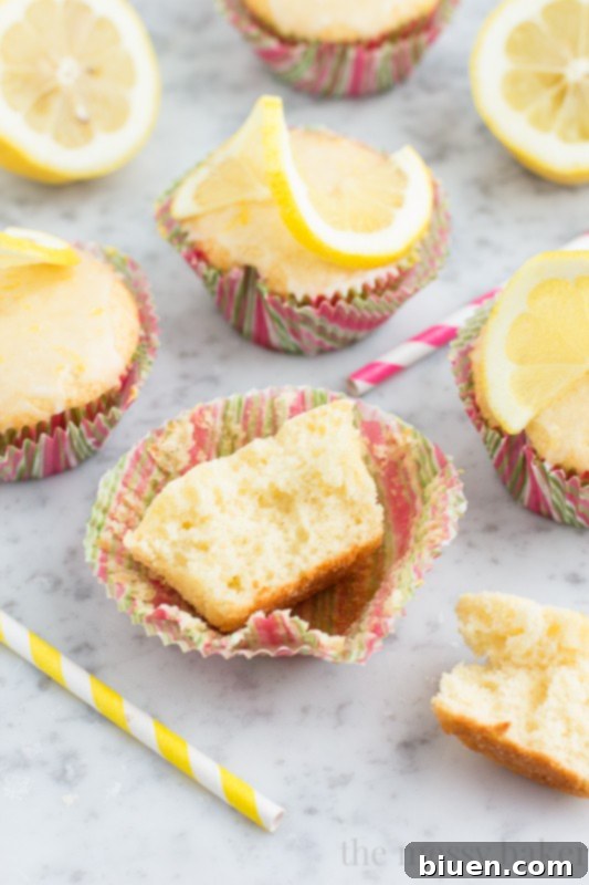 Sunshine Lemon Cupcakes with Zesty Glaze 9 Lemon Cupcakes with Lemon Glaze | www.themessybakerblog.com
