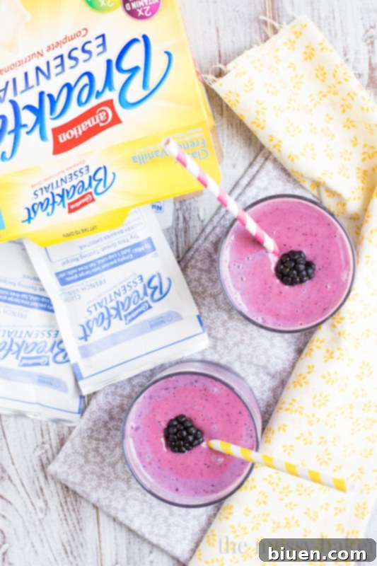 Ingredients for a Summer Berry Smoothie laid out on a kitchen counter