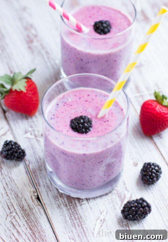 A bowl of assorted fresh berries: strawberries, blueberries, raspberries, blackberries