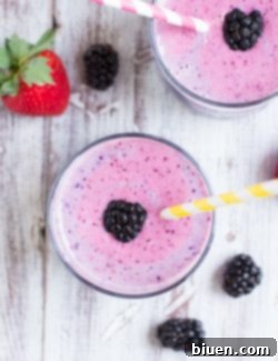 Final Summer Berry Smoothie in a glass, garnished with fresh berries