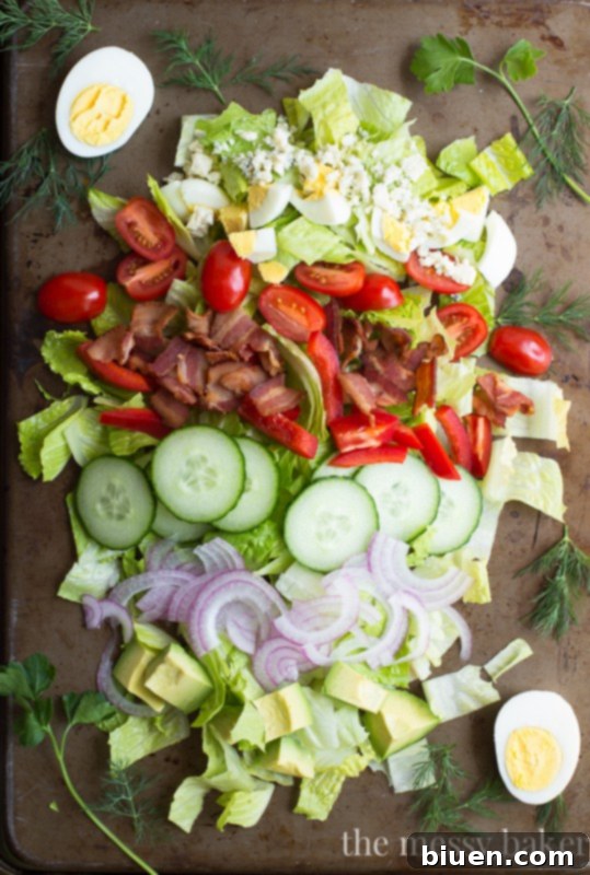 Garden Fresh Cobb Salad 2 Classic Cobb Salad generously topped with fresh dill and parsley, alongside crisp romaine, bacon, and blue cheese