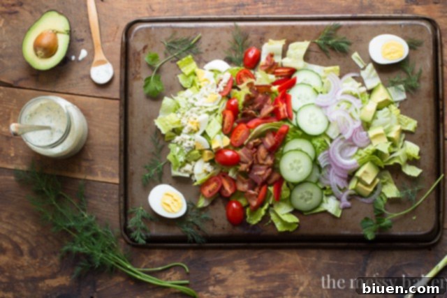 Garden Fresh Cobb Salad 5 A colorful array of Cobb Salad ingredients, including mixed greens, avocado, bacon, eggs, and tomatoes