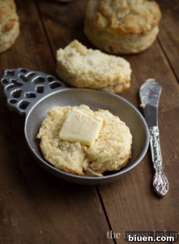 A stack of perfectly risen, golden buttermilk biscuits