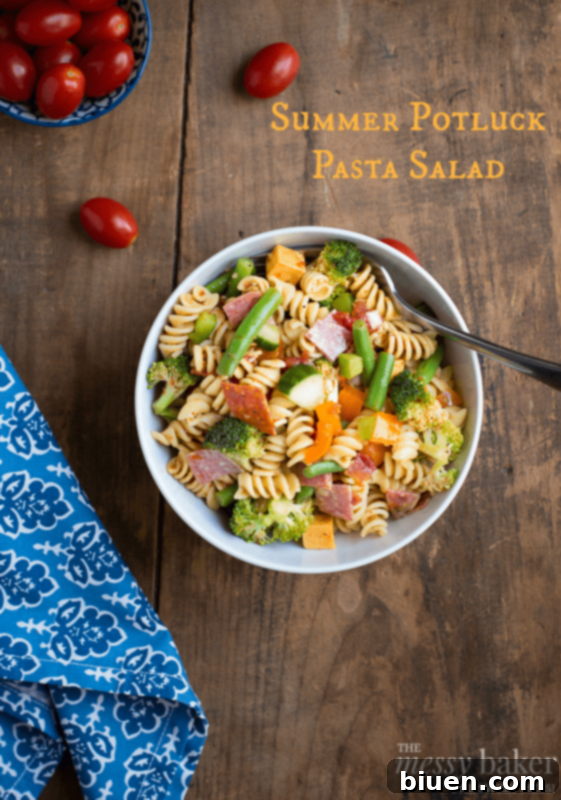 Vibrant Summer Pasta Salad with fresh vegetables, perfect for a potluck