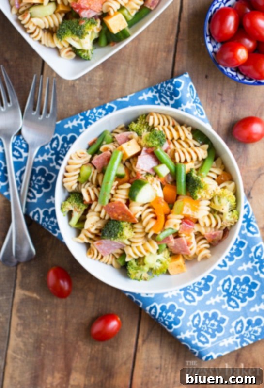Ingredients for Summer Pasta Salad including pasta, vegetables, and deli meats