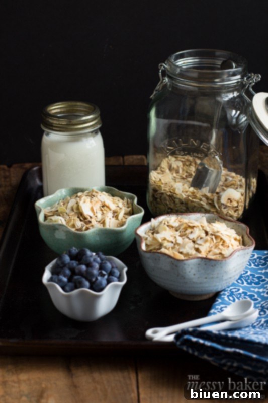 Hand sprinkling Toasted Coconut Muesli over Greek yogurt