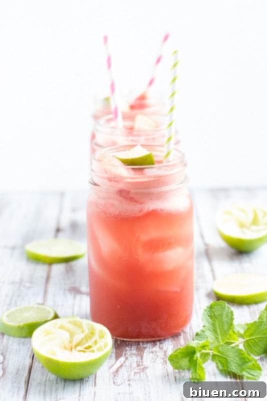 Pouring the Watermelon Mint Cooler mixture into glasses