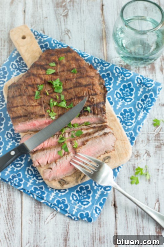 Close-up of a perfectly grilled tequila chipotle flank steak.