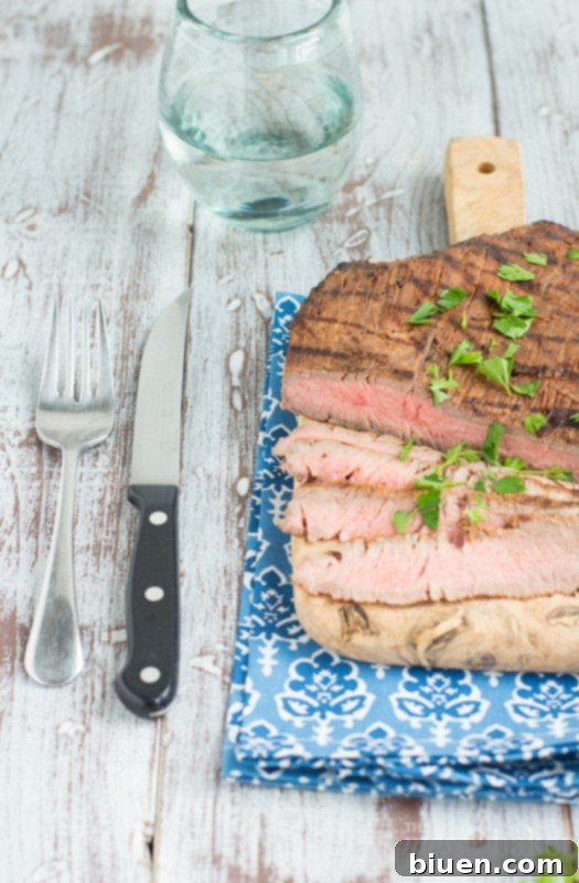Sliced Grilled Tequila Chipotle Flank Steak, ready to be served.