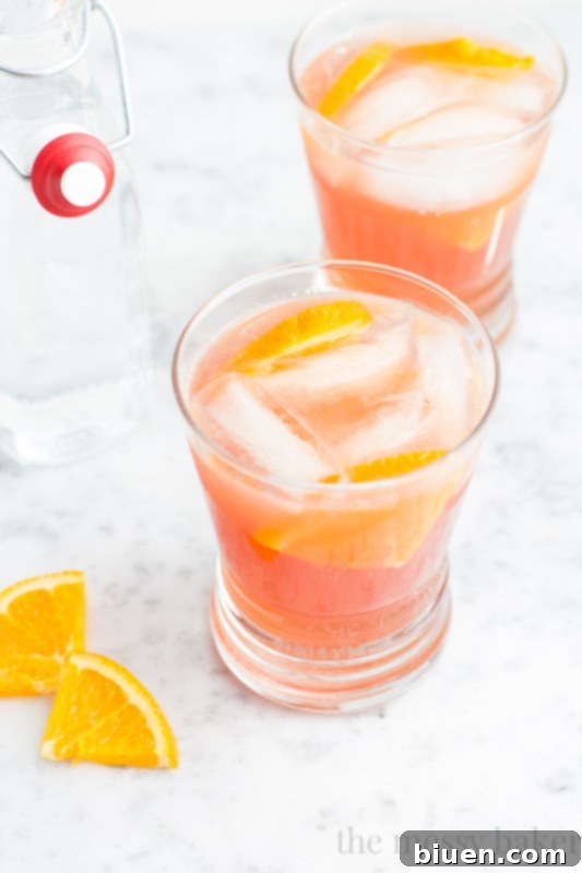 Delicious Cranberry Orange Spritzer with Orange Garnish