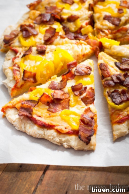 Zesty Gluten-Free Bacon Banana Pepper Pizza 5 Gluten-Free pizza crust being topped with sauce, cheese, banana peppers, and bacon