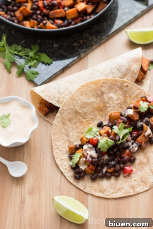 Delicious Sweet Potato and Black Bean Tacos with Chipotle Crema 2 Close-up of freshly assembled Sweet Potato & Black Bean Tacos