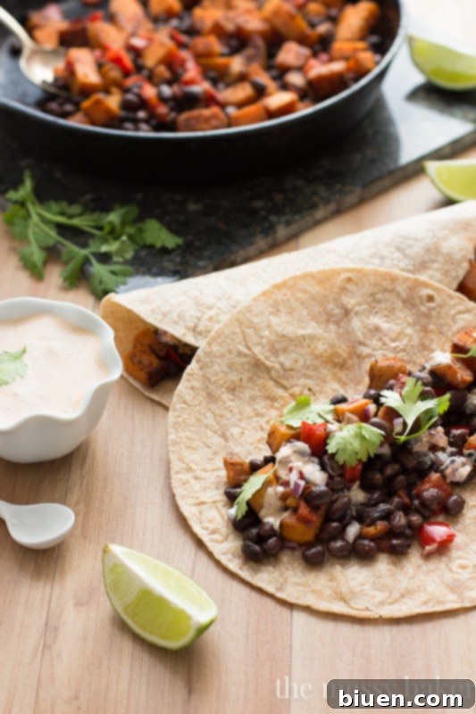 Delicious Sweet Potato and Black Bean Tacos with Chipotle Crema 7 Plate of vibrant Sweet Potato & Black Bean Tacos ready to eat