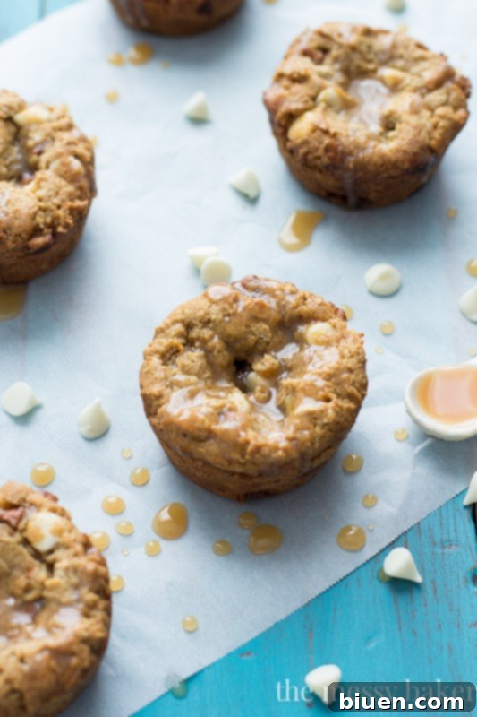 Guilt-Free Fall Indulgence: White Chocolate Pumpkin Cookie Cups 5 A side view of Gluten-Free White Chocolate Pumpkin Cookie Cups, revealing a soft, chewy interior.