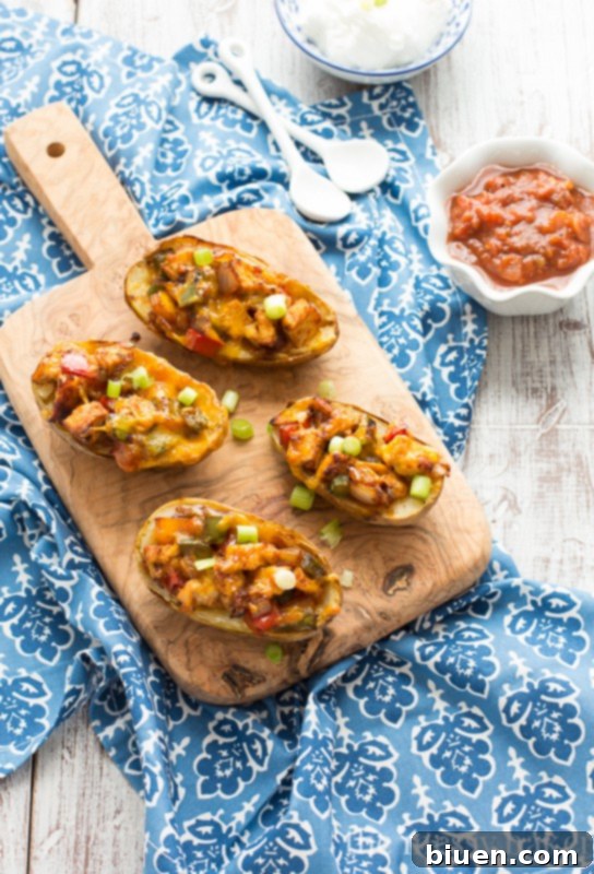 Gluten-Free Chicken Fajita Potato Skins | www.themessybakerblog.com | This is the perfect appetizer for football.