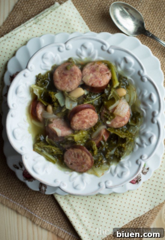 Hearty Slow Cooker Kielbasa, Kale and White Bean Soup 3 Slow Cooker Kielbasa Soup with Kale and White Beans | www.themessybakerblog.com