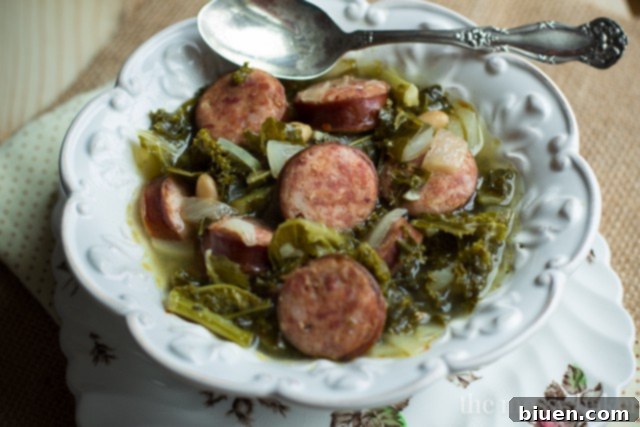 Hearty Slow Cooker Kielbasa, Kale and White Bean Soup 4 Slow Cooker Kielbasa Soup with Kale and White Beans | www.themessybakerblog.com