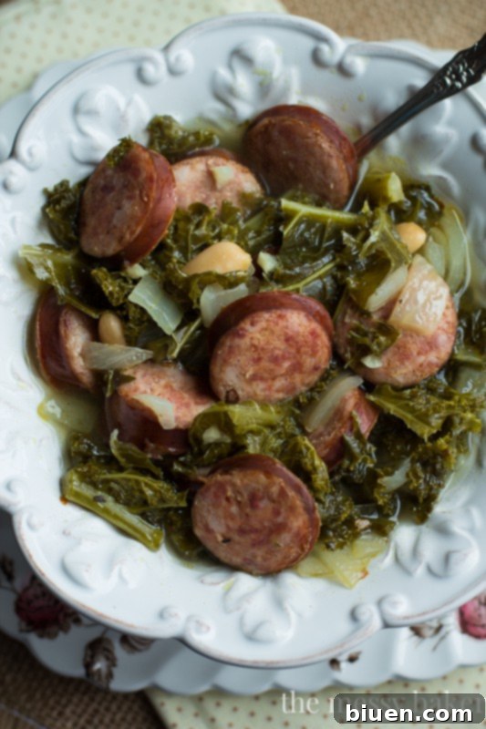 Hearty Slow Cooker Kielbasa, Kale and White Bean Soup 6 Slow Cooker Kielbasa Soup with Kale and White Beans | www.themessybakerblog.com