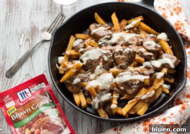 Gluten-Free Mushroom Swiss Poutine | A full view of the poutine, ready to be served, highlighting the generous toppings.