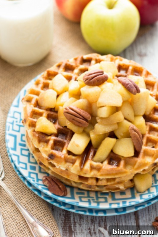 Close-up of golden Gluten-Free Cinnamon Chip Waffles with Caramelized Apples