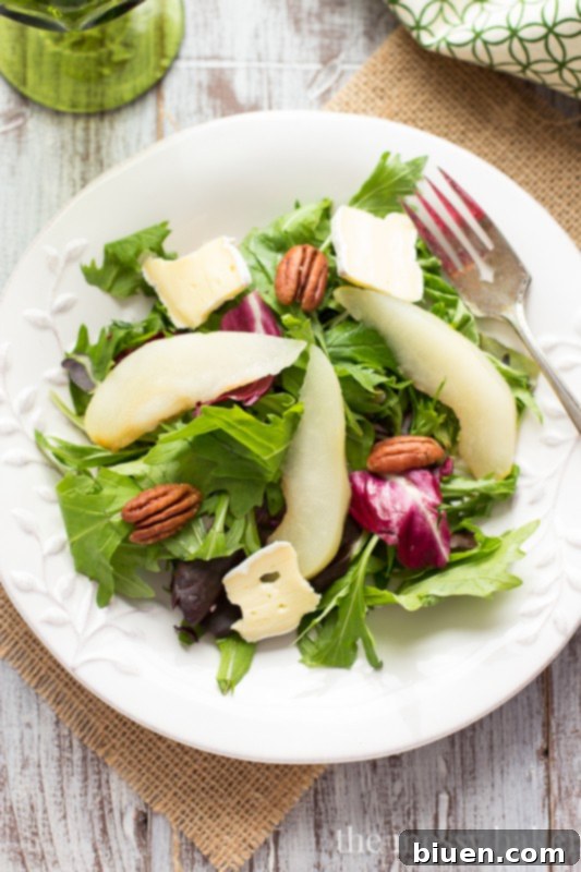 Poached Pear and Brie Salad with Balsamic Vinaigrette | www.themessybakerblog.com
