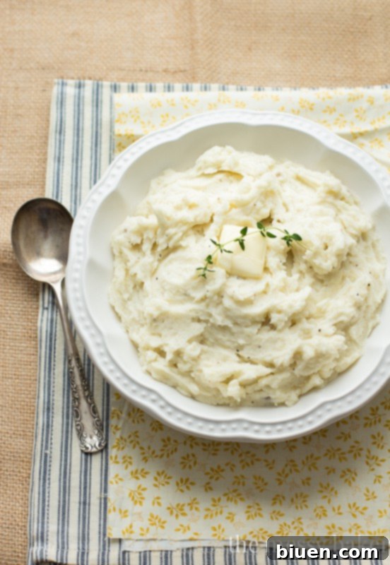Close-up of perfectly creamy mashed potatoes in a serving bowl, ready to enjoy.