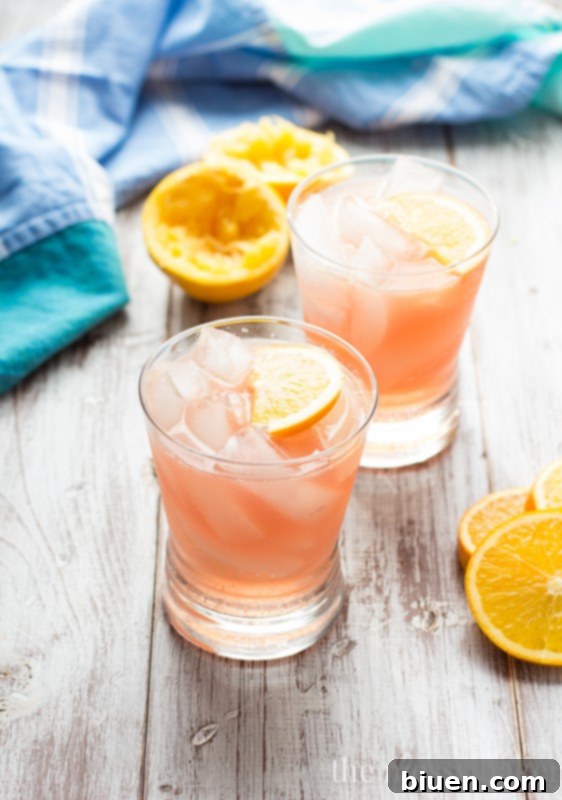 Vibrant Cranberry Orange Crush cocktail in a glass, ready to be enjoyed.