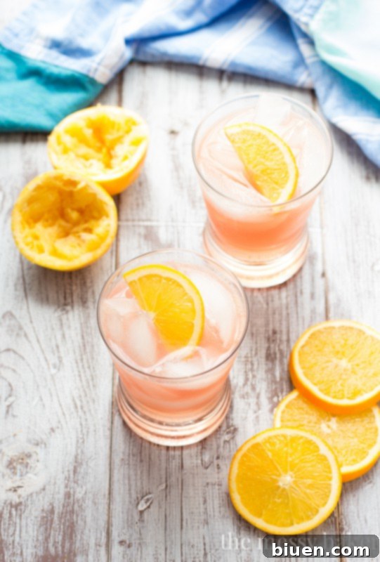 Another perspective of the colorful Cranberry Orange Crush drink, highlighting its refreshing quality.