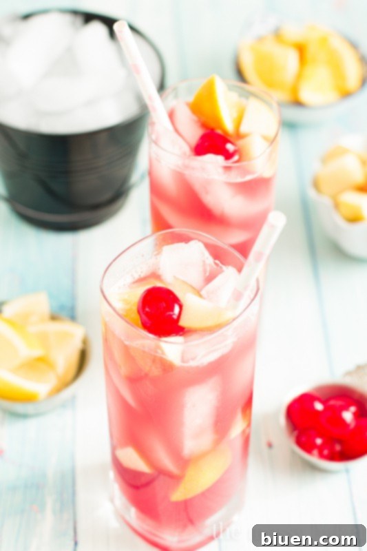 Irresistible Black Cherry Sangria 8 Glass of Black Cherry Sangria with a cherry garnish