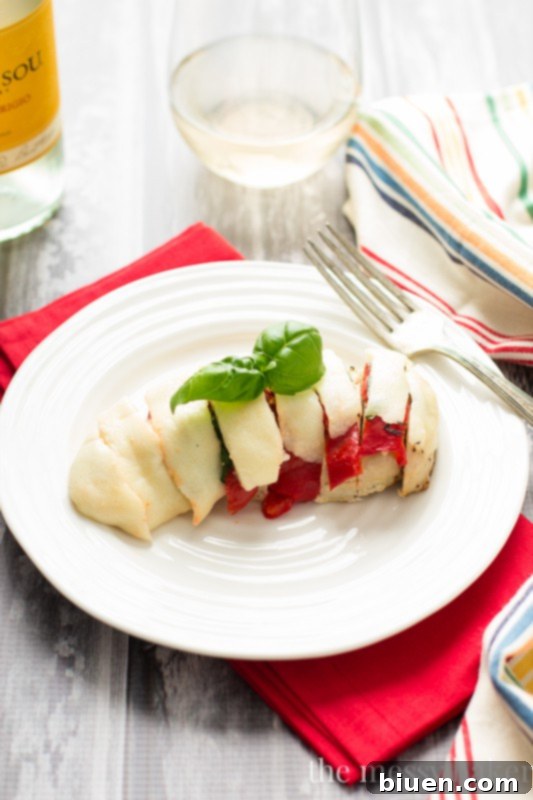 Roasted Red Pepper Caprese Chicken 2 Roasted Red Pepper, Basil, and Mozzarella Chicken, cooked and ready to serve, a perfect weeknight meal