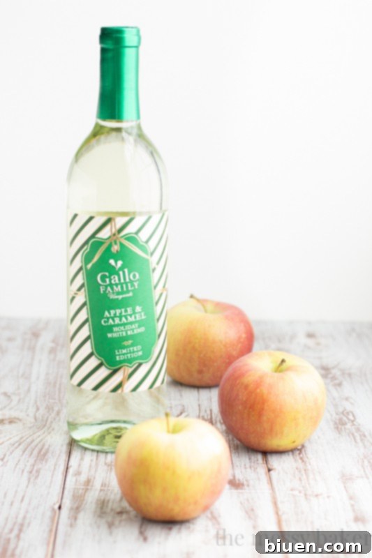 Fizzy Caramel Apple Sangria 3 Close-up of Sparkling Caramel Apple Sangria in a pitcher with fresh apple slices, ready to serve