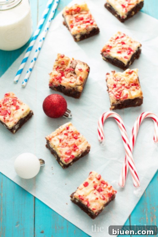 Close-up of freshly baked Peppermint Cheesecake Swirl Brownies, showing the distinctive layers