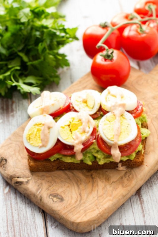 Healthy Avocado, Tomato, and Sliced Egg Toast. This open-faced sandwich is perfect for breakfast or lunch.