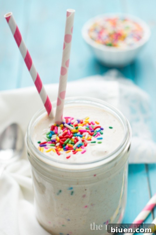 Delicious and healthy funfetti shake in a jar with straw