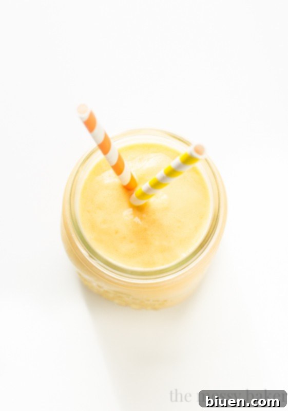 Ingredients for Tropical Lassi laid out on a wooden surface