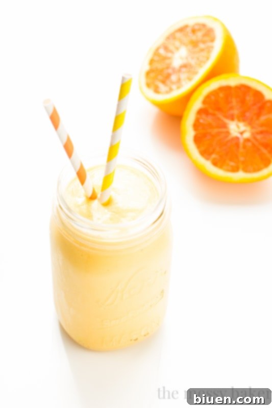 A refreshing glass of Tropical Lassi, ready to be enjoyed