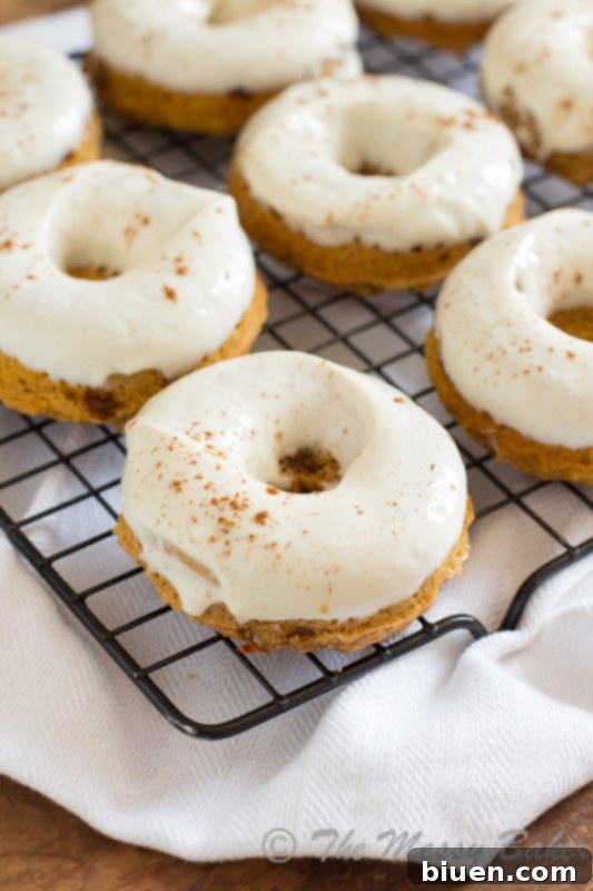 Skinny Pumpkin Cinnamon Chip Donuts with Maple Cream Cheese Glaze