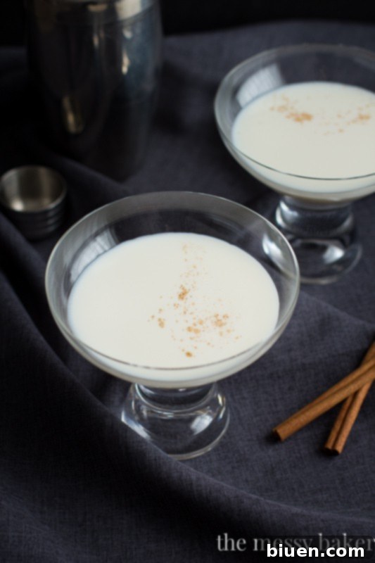 Warm Caramel Spice Martini 38 Caramel Cinnamon Martini featuring RumChata, Caramel Vodka, and a hint of warm Cinnamon for a creamy winter cocktail