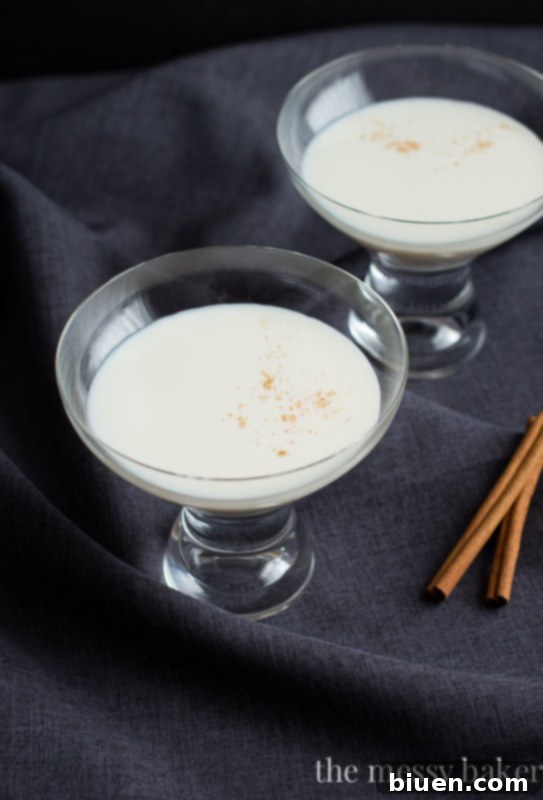 Serving a Caramel Cinnamon Martini with RumChata and Caramel Vodka in a chilled glass