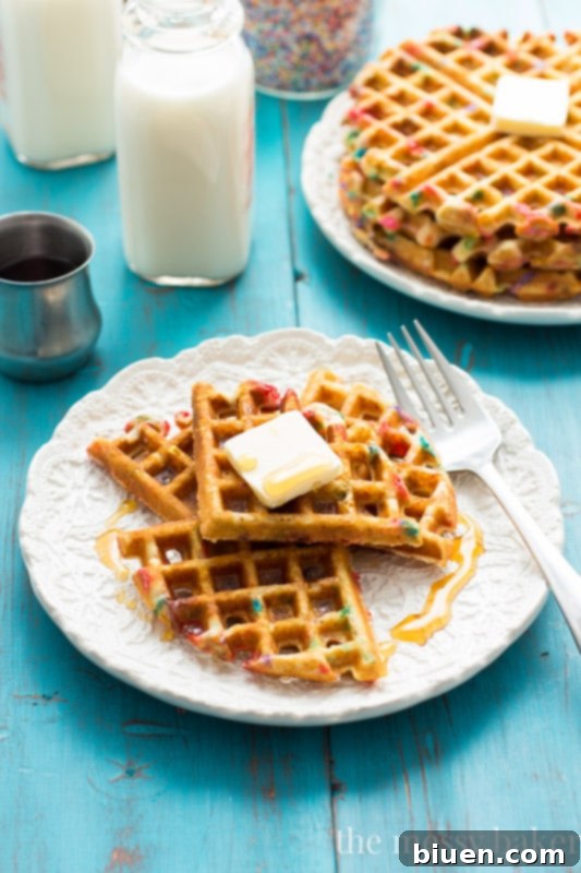 Freshly baked gluten-free and dairy-free Funfetti Waffle on a plate