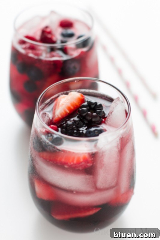 Summer Berry Moscato Sangria ingredients in a glass